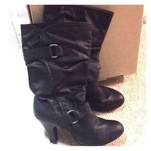 Heeled pull on black boots.